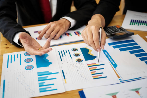 istock Group of business people discussing project plan together with analyzing data financial report in meeting room. Finance accounting concept. 1140167513