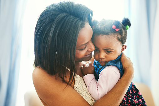 Shot of a mother bonding with her little daughter daughter at home