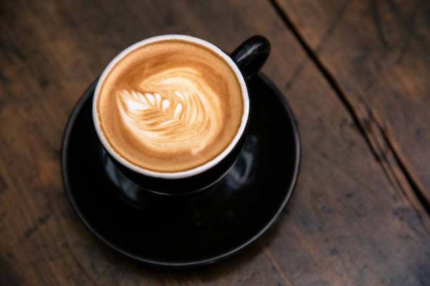 istock Cup of coffee on wooden table 1140167723