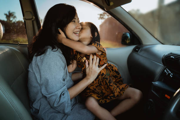 istock mother and kid enjoy trip in the car 1140167904
