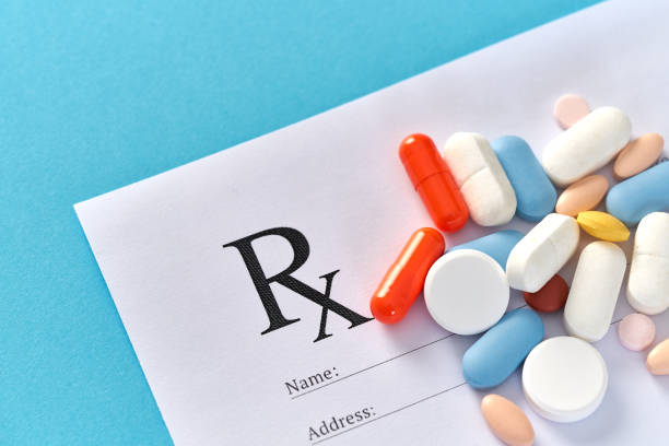 istock Many pills and tablets on blue background for medicine concept 1140168540
