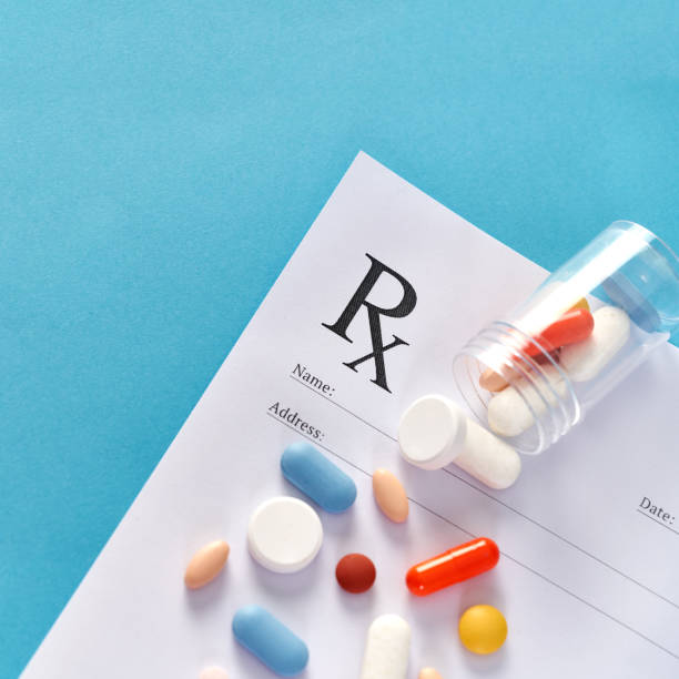 istock Many pills and tablets on blue background for medicine concept 1140169818
