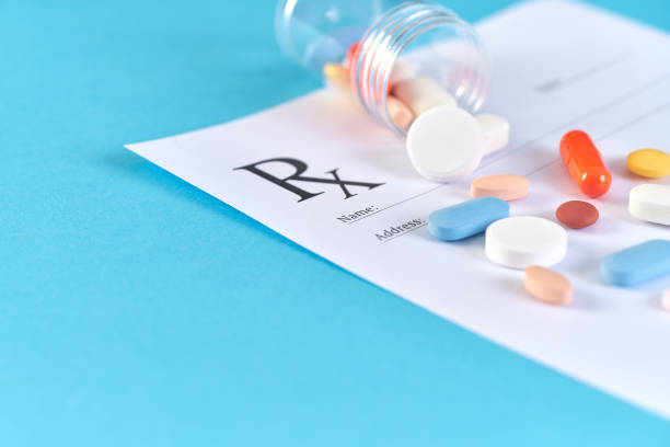istock Many pills and tablets on blue background for medicine concept 1140170030