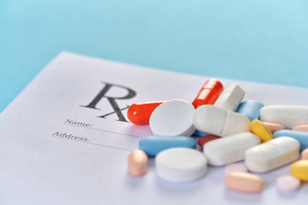 istock Many pills and tablets on blue background for medicine concept 1140170035