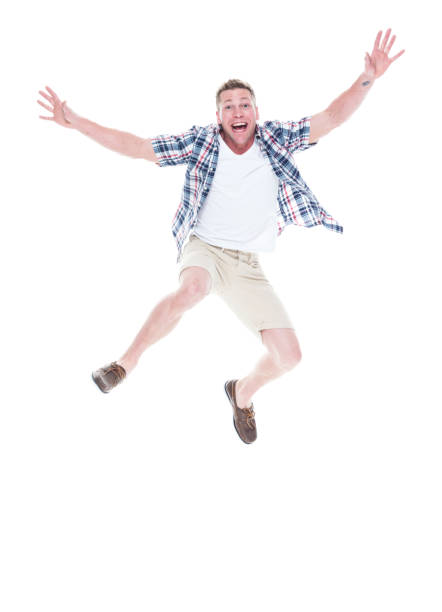 istock Handsome man in shirt and shorts is jumping 1140170280