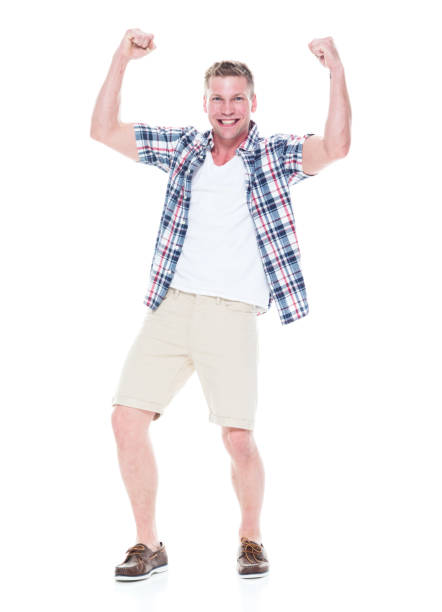 istock Handsome man in shirt and shorts is cheering with hands up 1140170362