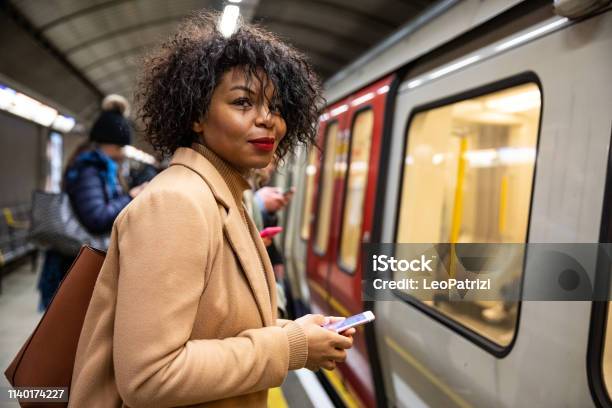 Woman Waiting For The Subway Train Stock Photo - Download Image Now - Commuter, Women, Subway