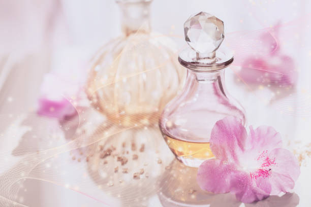 istock Spa still life with perfume and aromatic oils bottles surrounded by flowers 1140178230