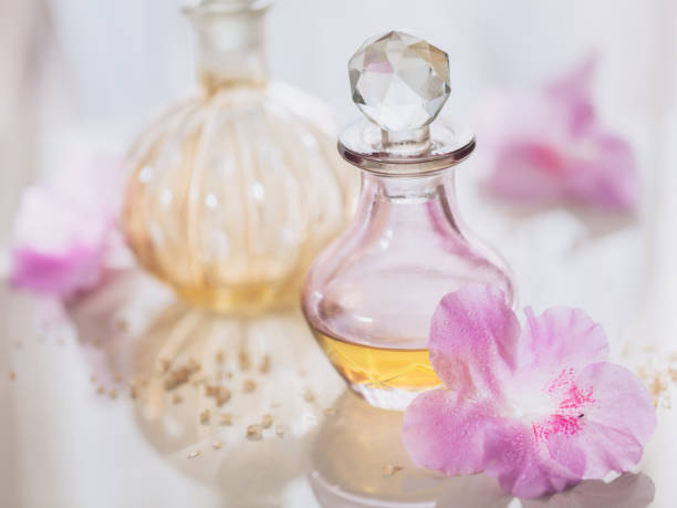 istock Spa still life with perfume and aromatic oils bottles surrounded by flowers 1140178231