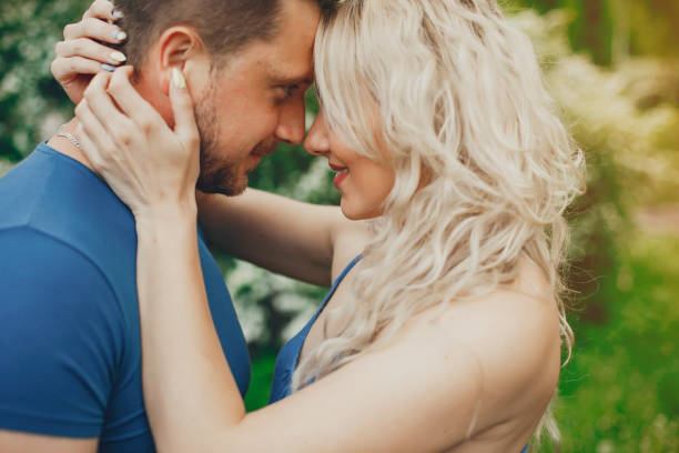 istock Beautiful couple spend time in a summer park 1140178672