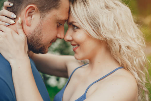 istock Beautiful couple spend time in a summer park 1140178693