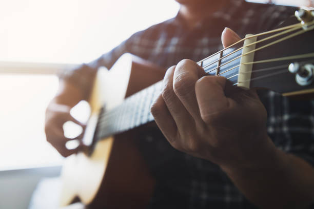 istock Close up men playing the guitar 1140179930