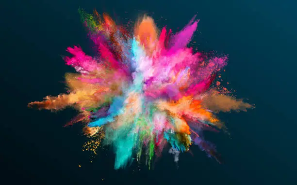 Photo of Colored powder explosion on black background.