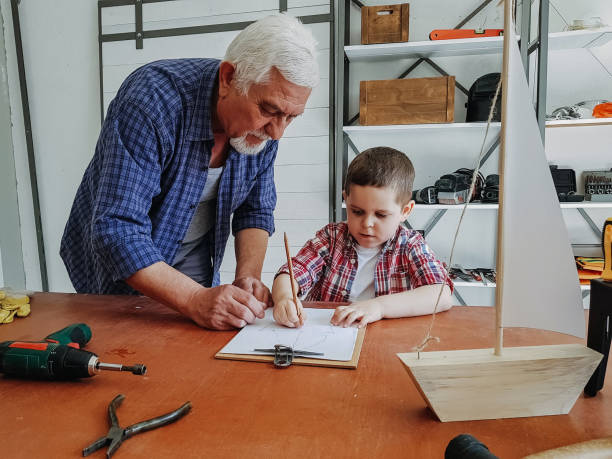 istock Grandfather teaching his grandson 1140183902