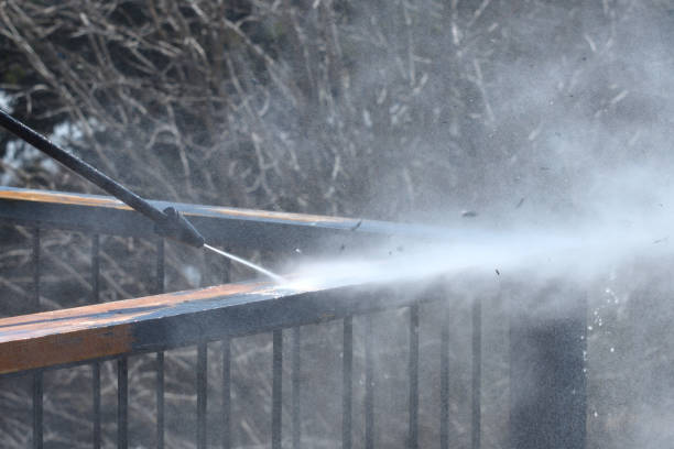 istock Power Washer  Being Used to Remove Loose Paint on a Deck Railing 1140184778