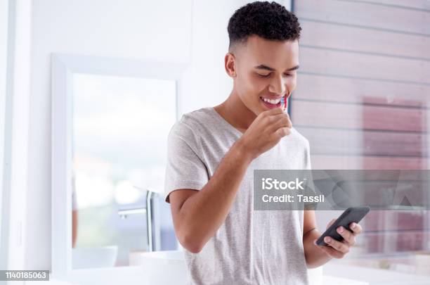 Fresh Day Fresh New Social Network Updates Stock Photo - Download Image Now - Brushing Teeth, Bathroom, Mobile Phone