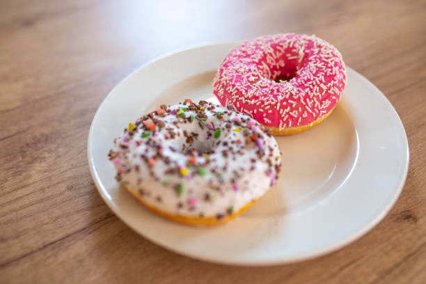 istock Sweet and tasty donuts with different sprinkles. 1140187422