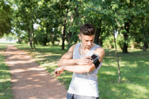 istock Man preparing for a jog at park 1140187472