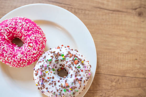 istock Sweet and tasty donuts with different sprinkles. 1140188379