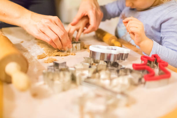istock Mother and daughter making cookies 1140191388