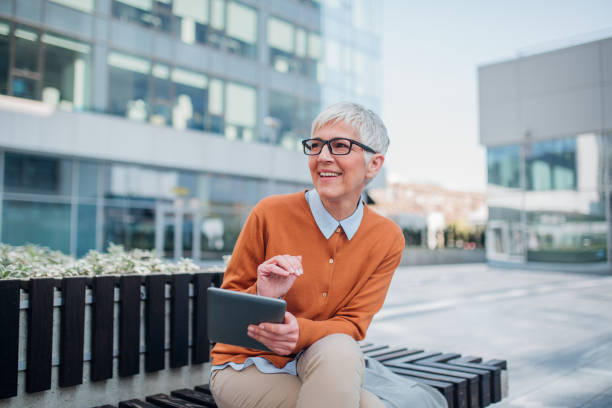 istock Woman holding digital tablet 1140192868