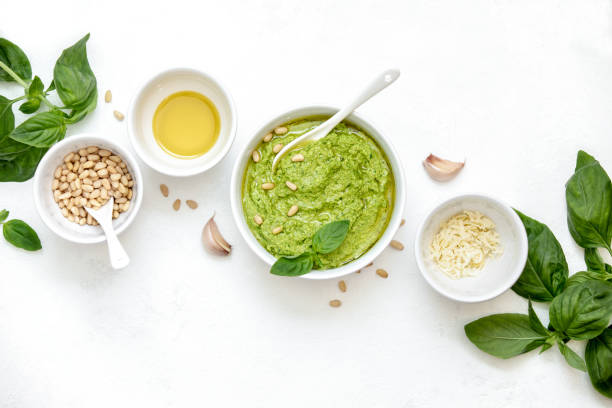 Pesto sauce with ingredients, overhead view Pesto sauce with ingredients, overhead view, blank space for a text pesto sauce stock pictures, royalty-free photos & images