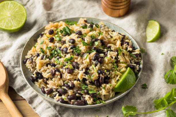 Homemade Mexican Black Beans and Rice Homemade Mexican Black Beans and Rice with Cilantro beans and rice stock pictures, royalty-free photos & images