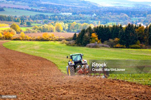 Tractor Plowing The Field Stock Photo - Download Image Now - Plowing, Tractor, Agriculture