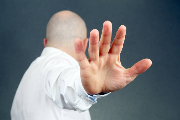 istock the negative gesture of men turned aside 1140198495