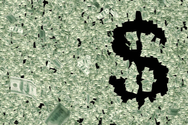 A lot of money flies around and shapes a dollar sign $. Symbol on black background stays empty with money