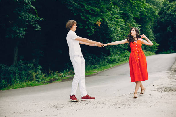 istock Cute couple in a summer park 1140202361