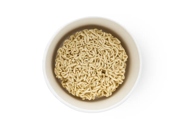 istock Egg noodles on a white background. Dry egg noodles in a container on a white background. 1140203042