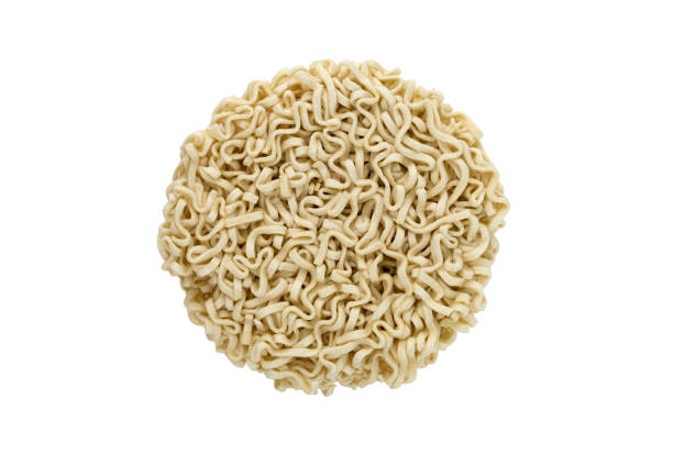 istock Egg noodles on a white background. Dry egg noodles close up on white background. 1140203126