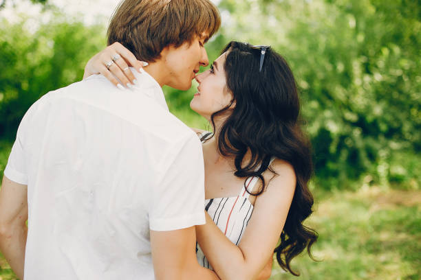 istock Cute couple in a summer park 1140204872