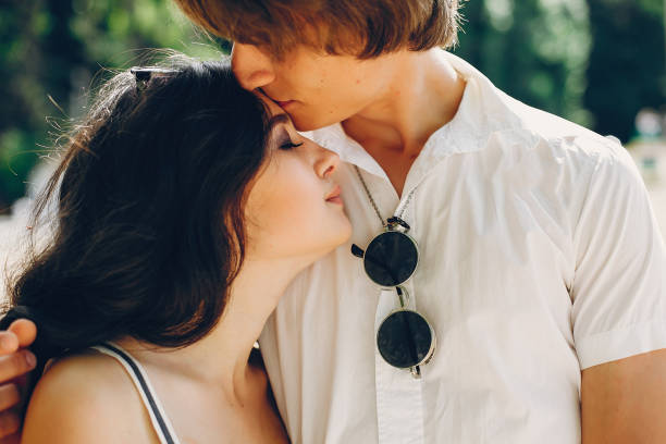 istock Cute couple in a summer park 1140205033