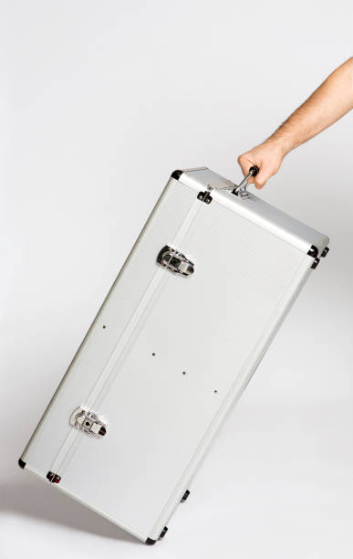 istock man carrying the big white silver case on the white background 1140205692