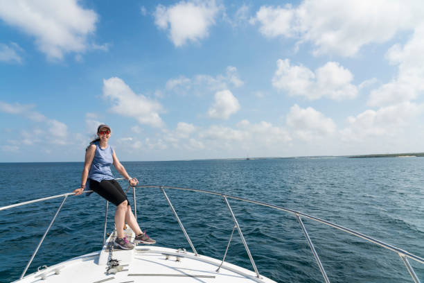 istock Mature woman standing on the boat 1140206614