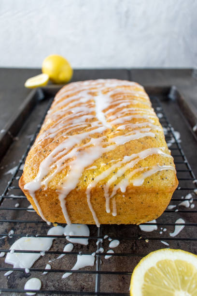 istock baked lemon poppy seed cake loaf with white icing drizzle 1140207658