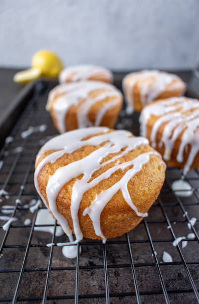 istock baked lemon poppy seed cupcakes with white icing drizzle 1140207668