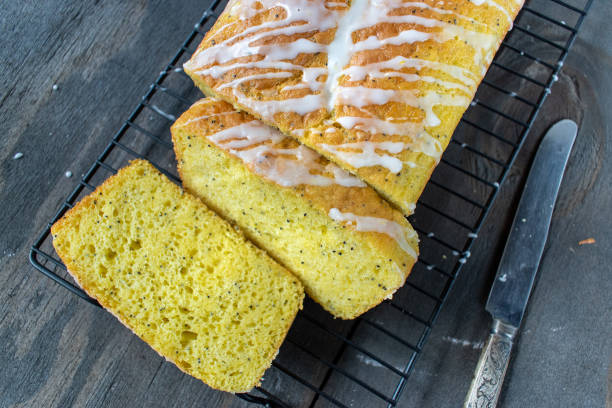 istock baked lemon poppy seed cake loaf with white icing drizzle 1140208163