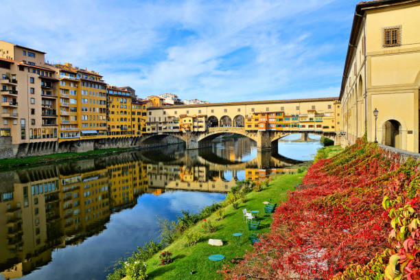istock Medieval Ponte Vecchio with reflections during autumn, Florence, Tuscany, Italy 1140208539