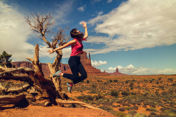 istock Woman Jumping, Happy Expression. Monument Valley Trip 1140208621