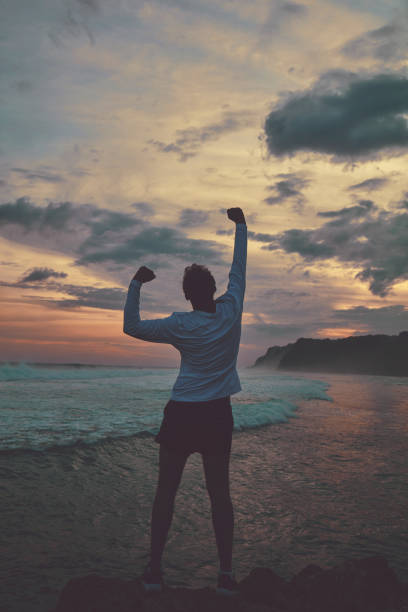 istock Man enjoying on the beach. 1140209490