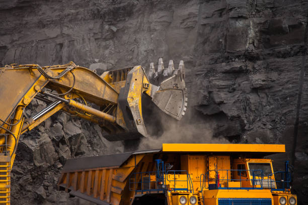 istock Mining dump truck loaded with coal in a coal mine large bucket 1140210019