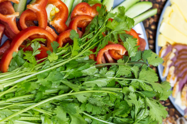 istock Cut cucumbers and tomatoes pepper parsley on table 1140212390
