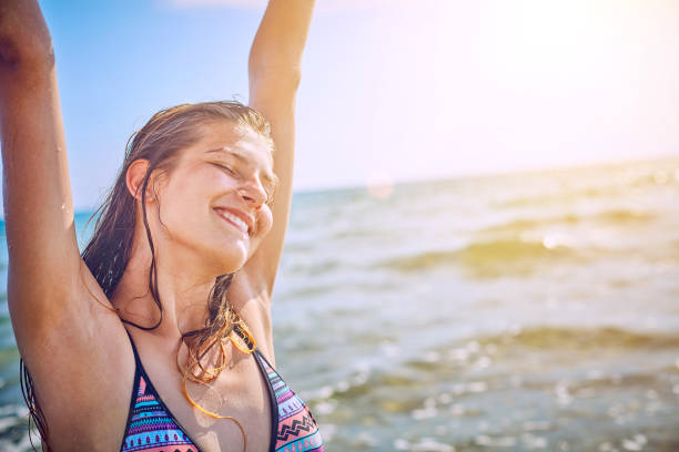 istock Happy Girl having fun on tropical beach 1140213528