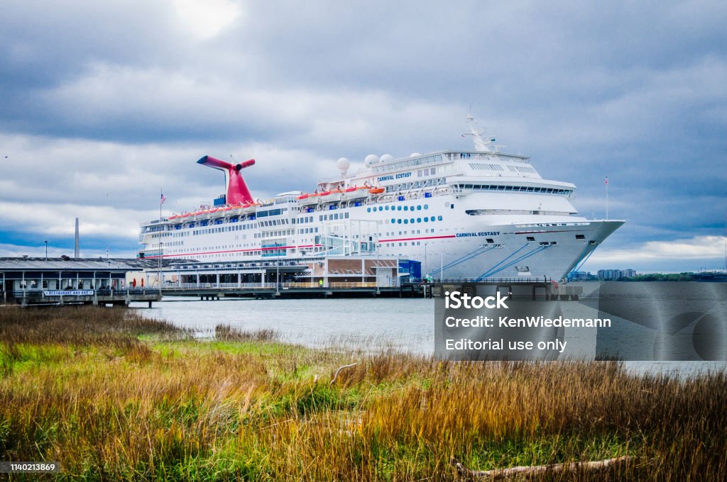 Ecstacy in Charleston Charleston, South Carolina, USA -March 26, 2019-The Carnival Cruise ship the "Carnival Ecstacy" awaits passenger boarding at its port in Charleston, South Carolina for 3-5 day cruises to the Bahamas. Carnival Cruise Line Stock Photo