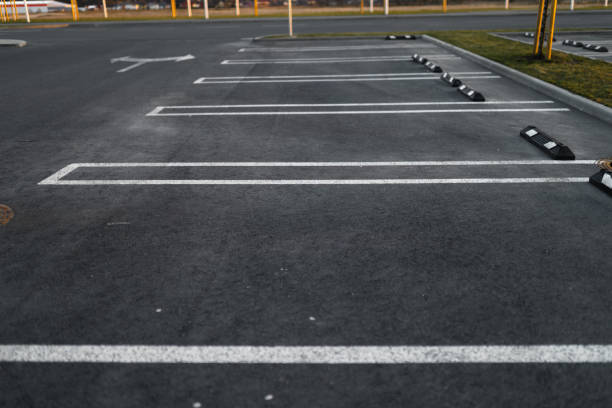 istock Empty parking lots during Golden Hour sunset at a popular typical Shopping centre 1140216576