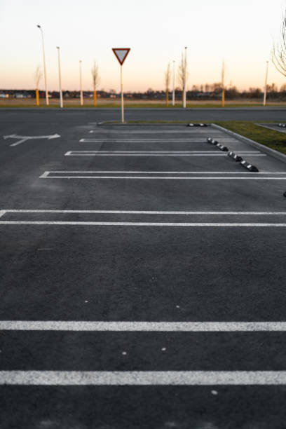 istock Empty parking lots during Golden Hour sunset at a popular typical Shopping centre 1140216643