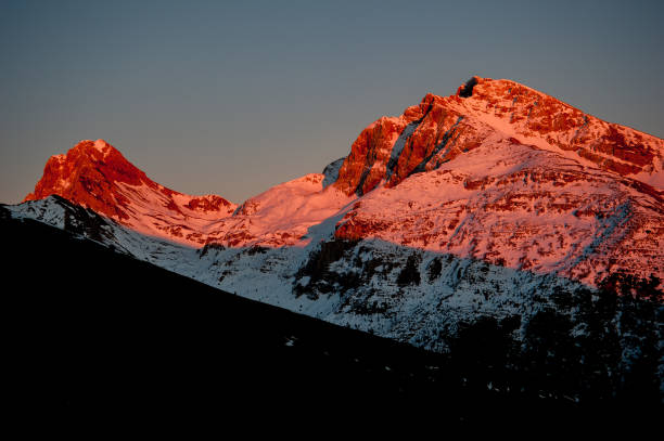 istock summit of the mountain with snow at sunset 1140216832